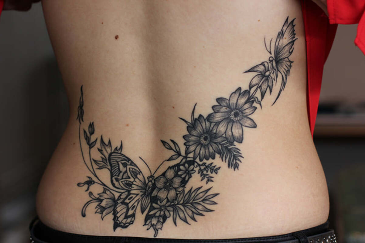Tatouage Bas Du Dos Femme Tribal Mars Tattoo - Tatoueur à Mars-la-Tour - Le meilleur du tatouage